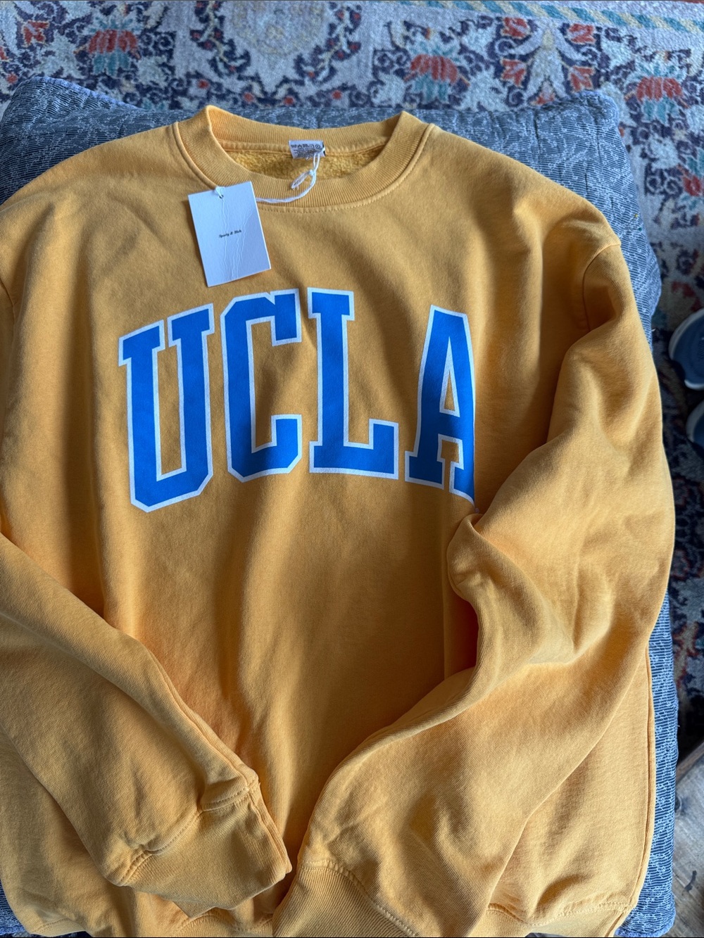 Sporty & Rich Gold Crewneck Sweatshirt with Blue UCLA Lettering